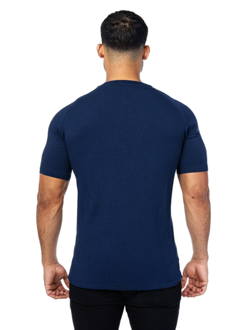 Man wearing a Aleano navy blue t-shirt on a white background