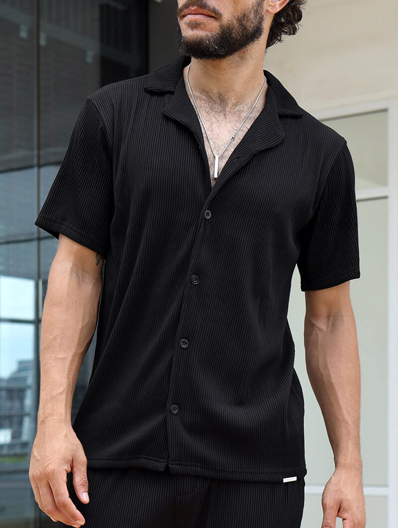 Man wearing a  Balinaro Bailey black  textured shirt with a blurred background