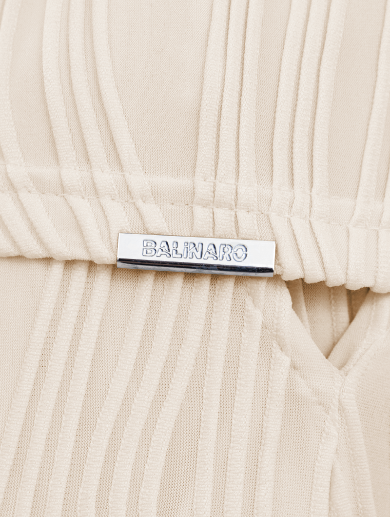 Close-up of a Rio beigeshort with a visible Balinaro label 